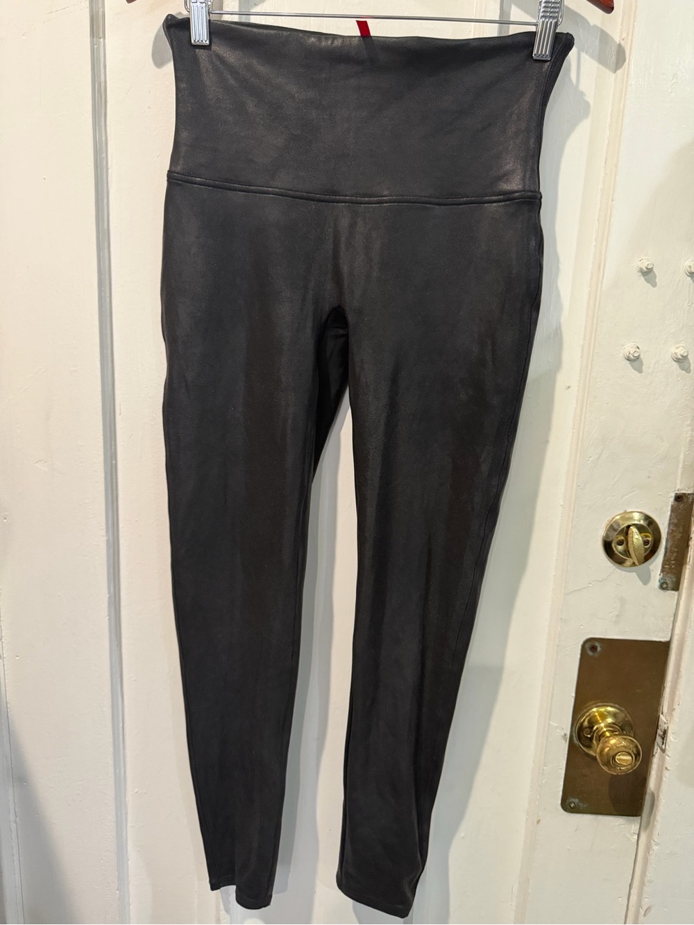 SPANX Black Shapewear Garment with Red Logo Tag